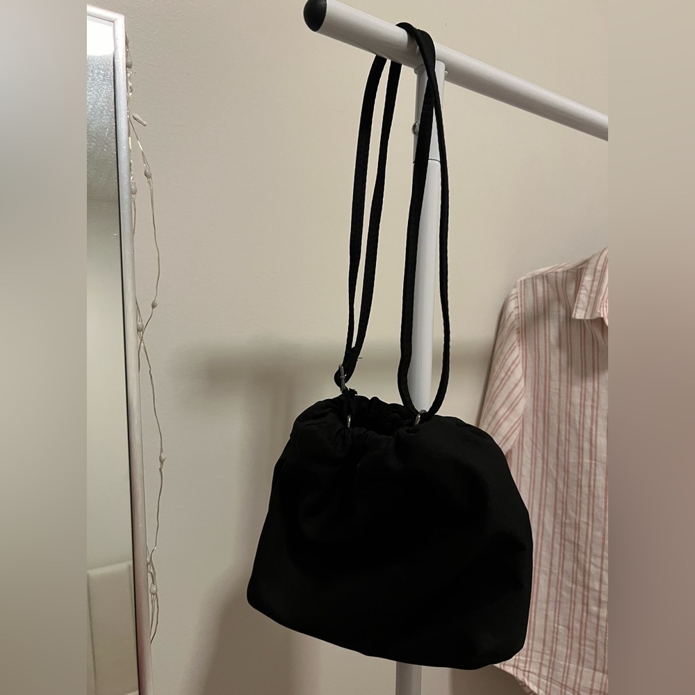 black purse with adjustable strap